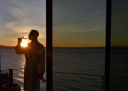 Man at Sunset Drinking Glass of Wine